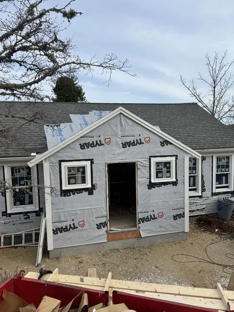 After: April 17, 2025: the new front addition framed. April 18: sheathed, wrapped and windows in.