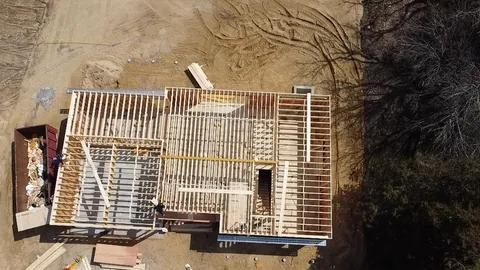 Before: From straight above: our crew’s walls framed on the deck, then the same house finished under its new roof.