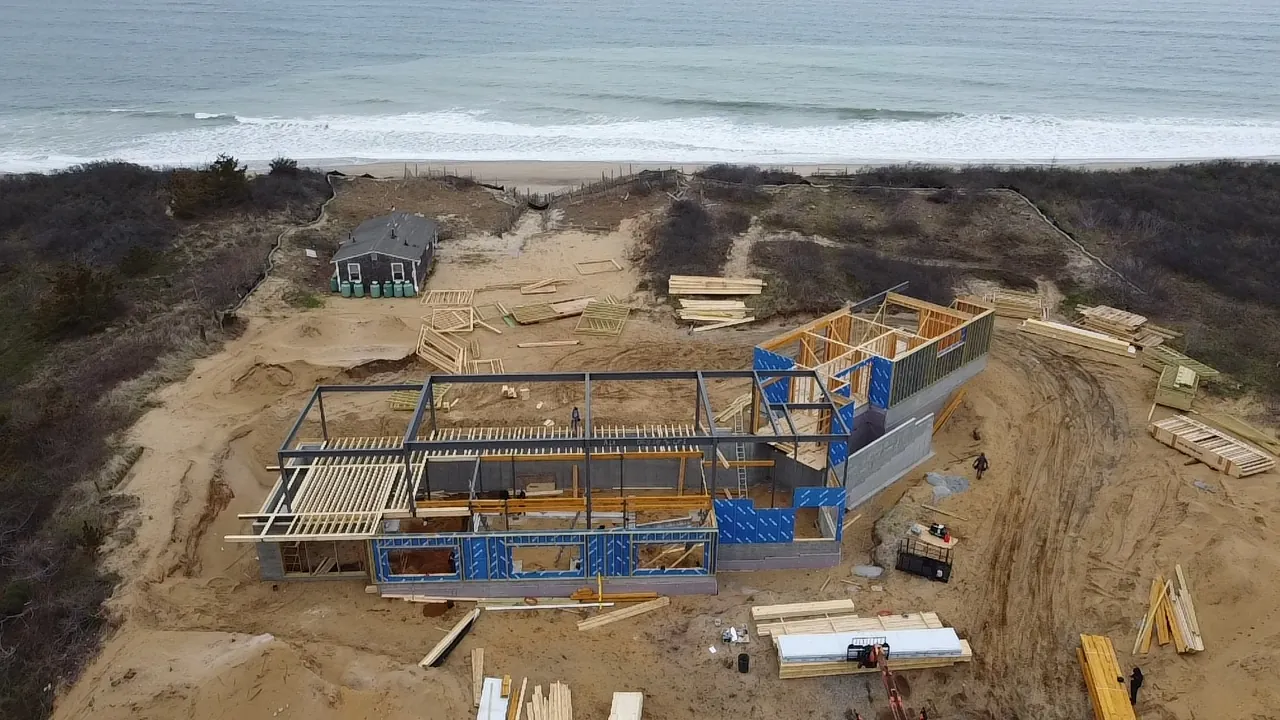 Oceanfront house in framing, seen from the air