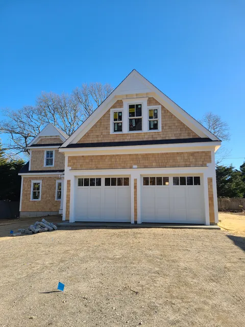 Cedar shingle home with a two-car garage