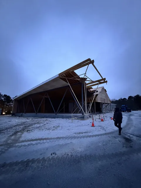 The church project in winter, with its roof structure going up