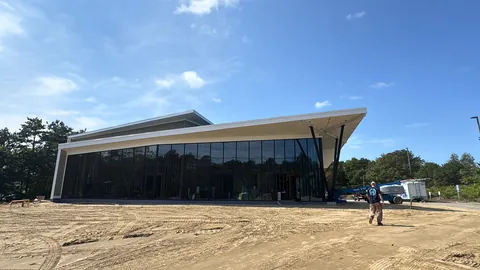 The finished church project: a glass front under a sweeping roofline