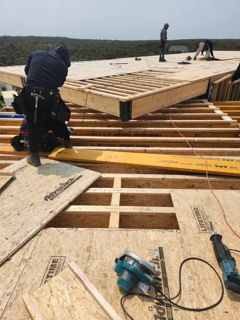 Crew sheathing a floor deck