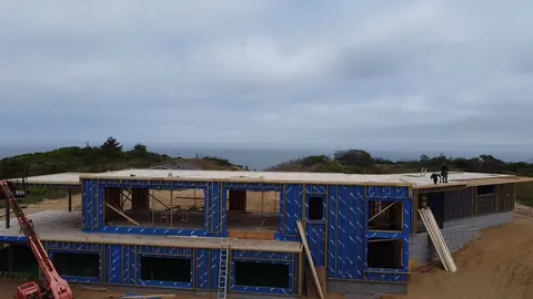 Two-story oceanfront house in framing