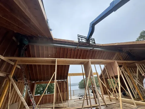 Inside a renovation with the roof opened up and a view of the water