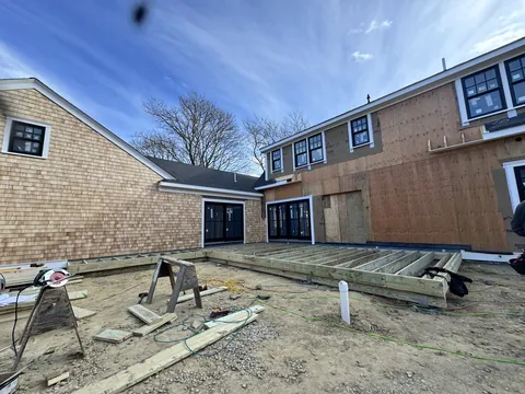 New wing framed onto a cedar shingle home